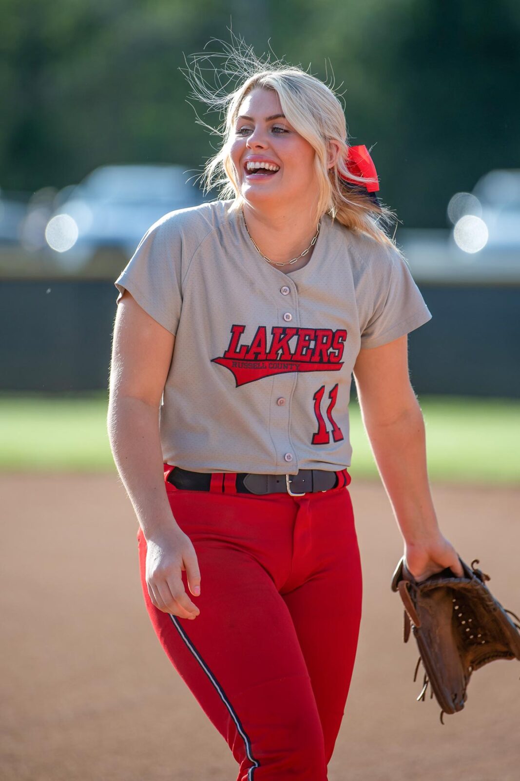 Girl wearing Lakers softball uniform