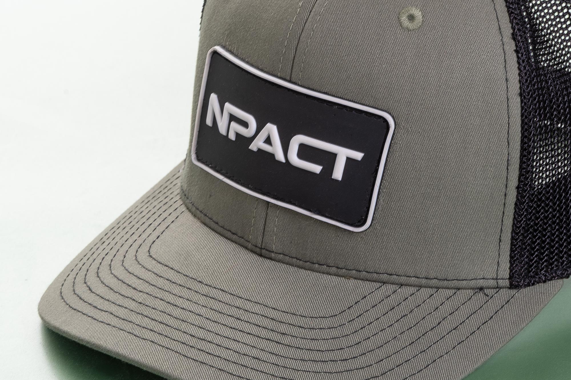 Close view of cap with NPACT logo patch