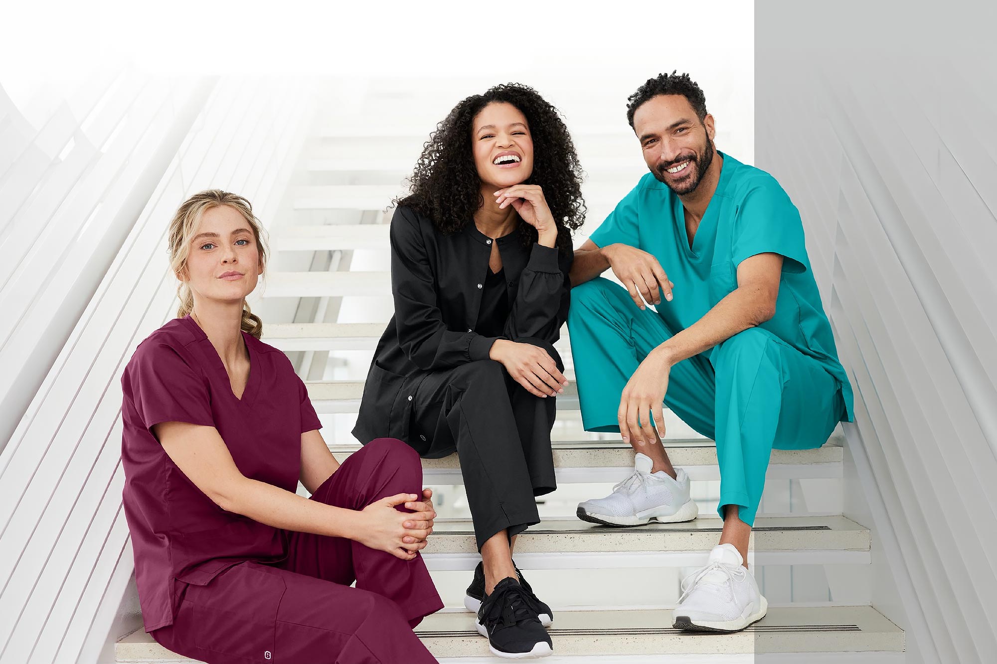 group of people wearing different color medical scrubs